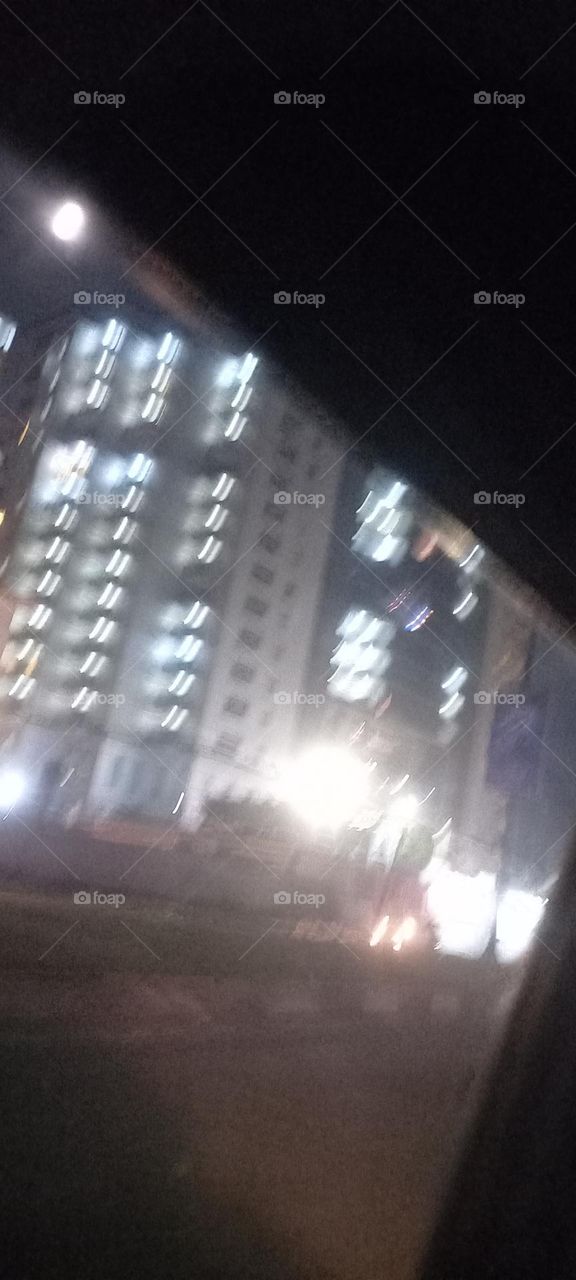 Twinkling windows , the beauty of evening light. Bask in the beauty of evening light with the view of light twinkling from these windows at night