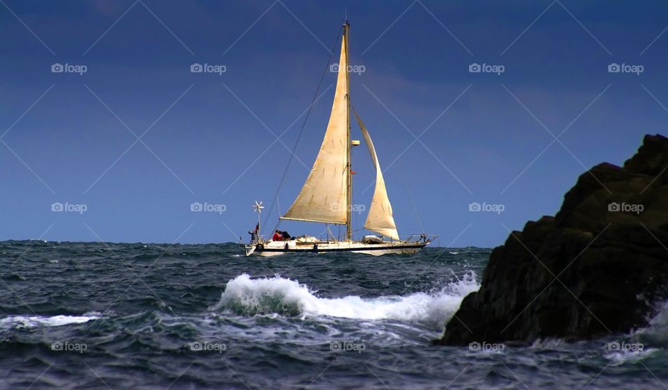 Sailboat with yellow sails