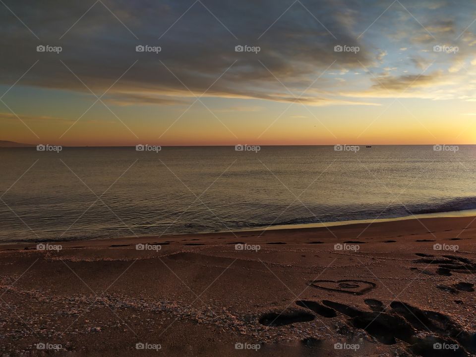 When you wake up very early and go to the beach to meet the sun. Everything has subsided - water, wind, birds. Everything is waiting for the great fiery sphere to rise and flood us with light and hope. Magical!