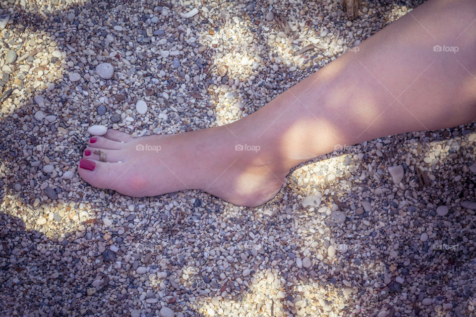 female feet at the beach