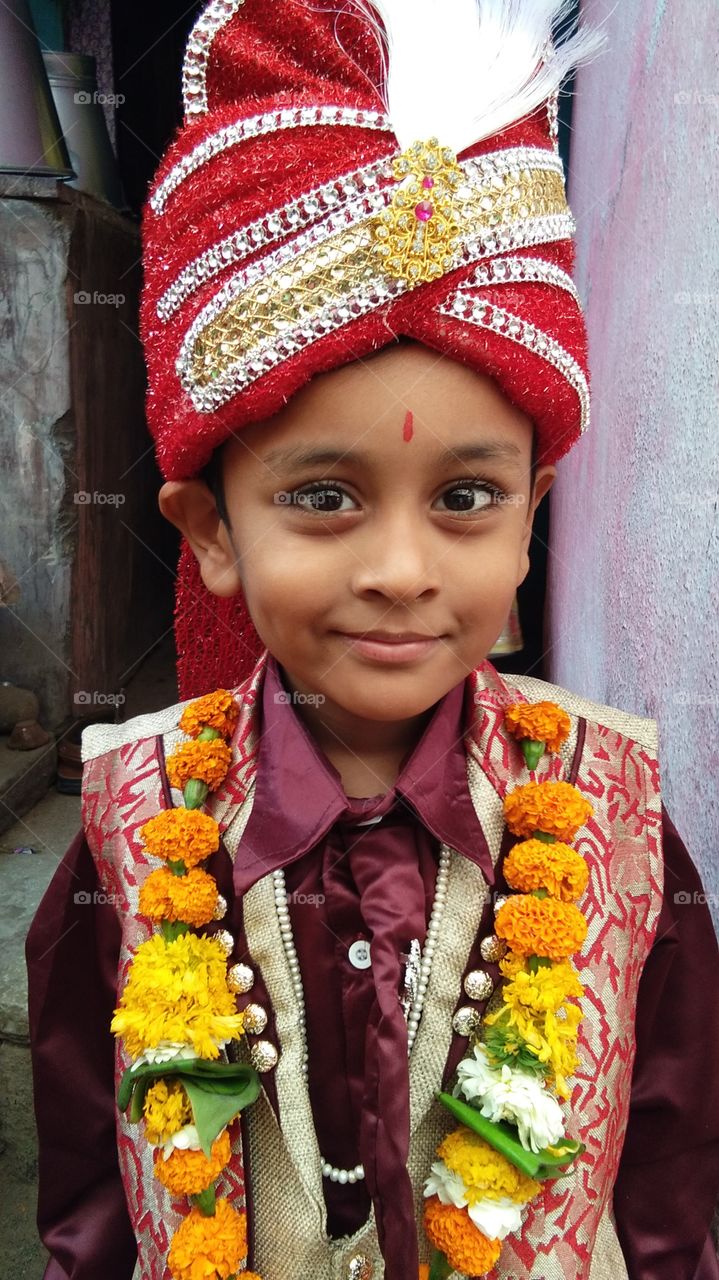 Portrait of an Indian boy wearing garland