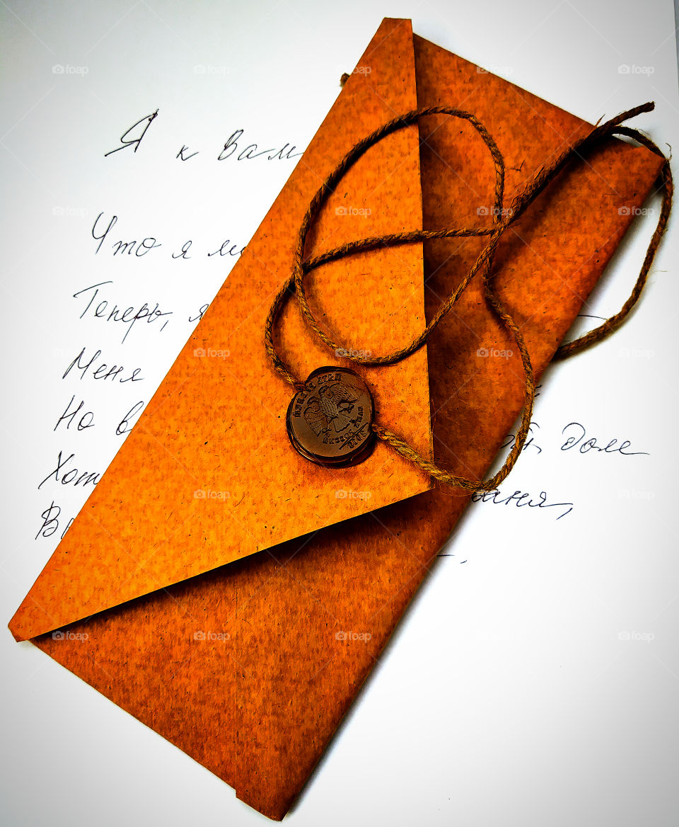 Nostalgia.  Brown envelope with a wax seal and a sheet of paper with a letter