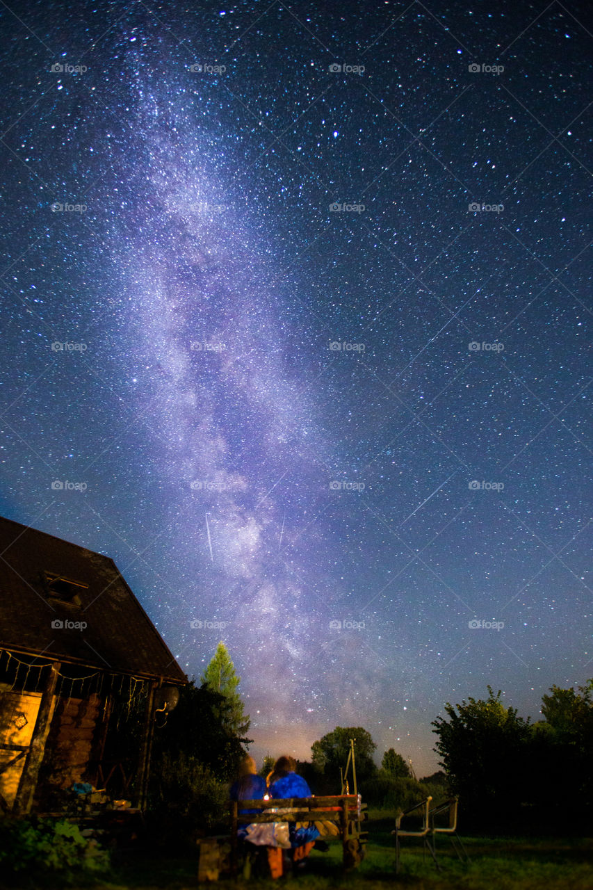 The night in dark Lithuanian village. Taking photo of Milky way and perseid meteor shower.