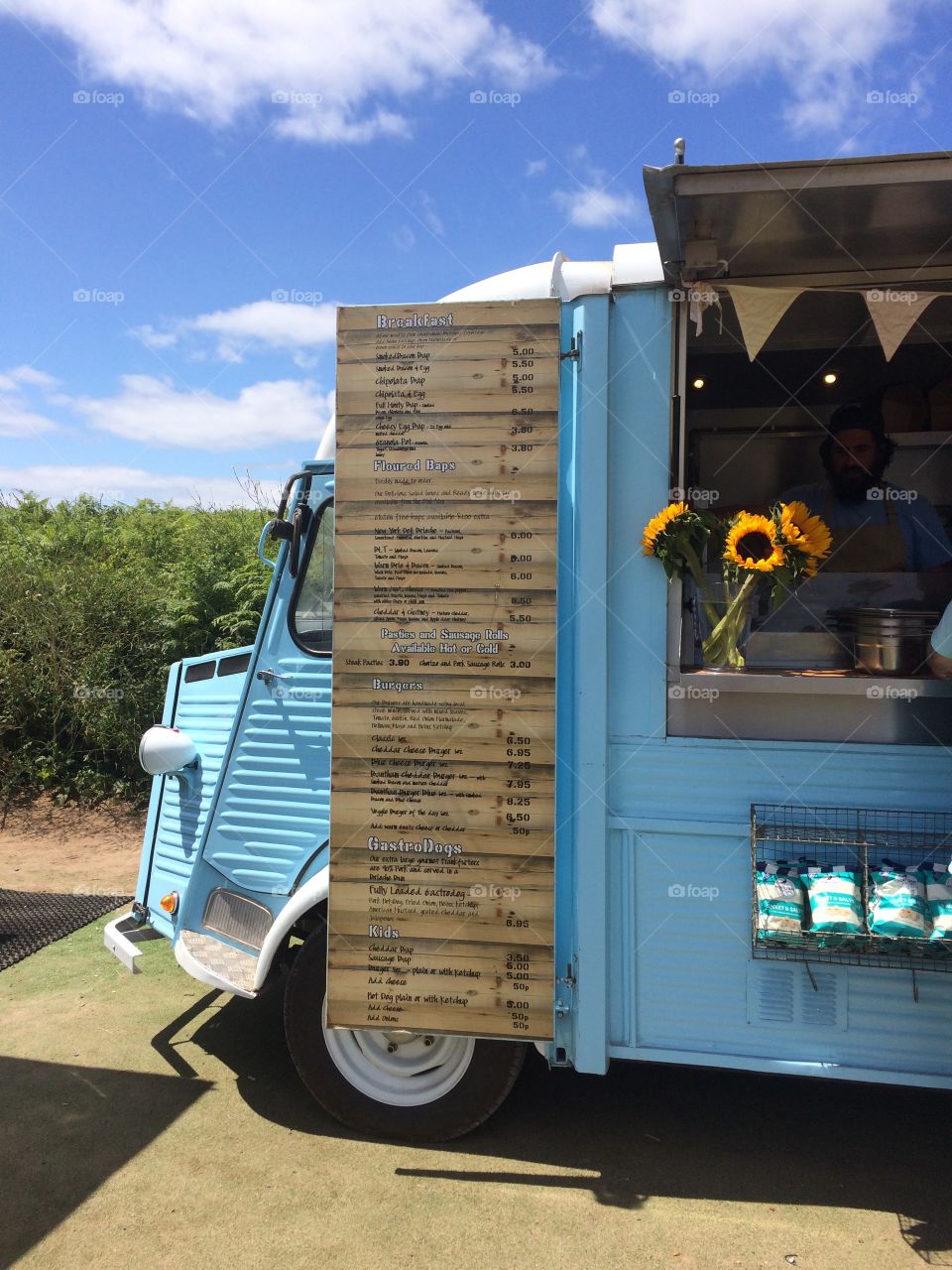 Blue Food Van with Sun Flowers