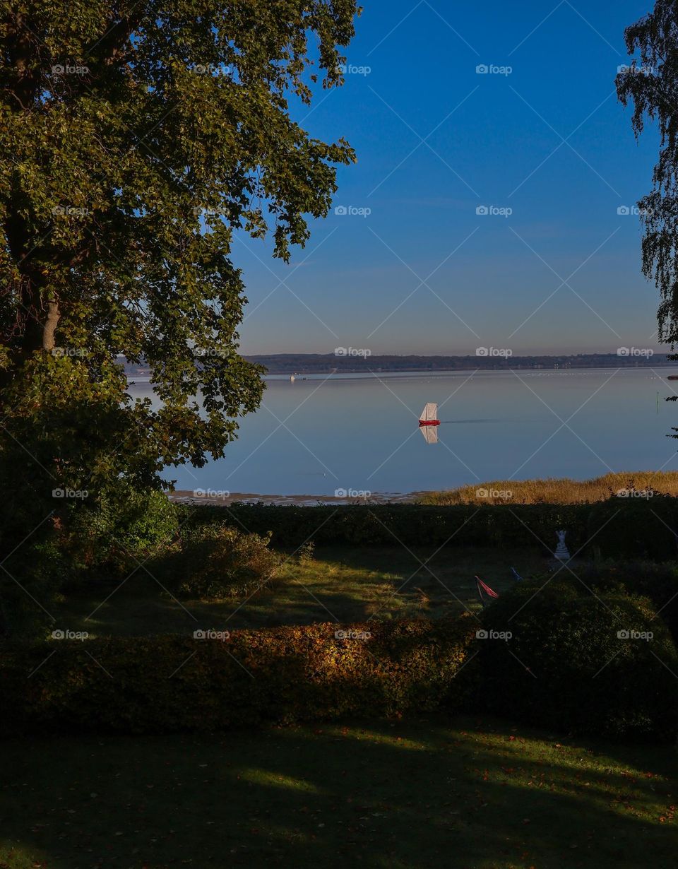 Small red boat on the lake