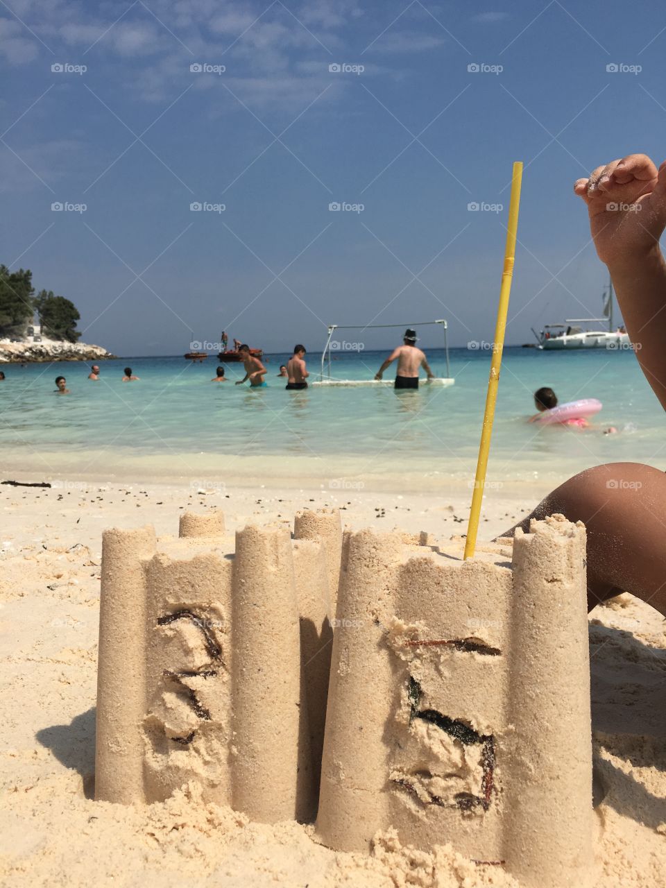 Sand birthday cake on the beach