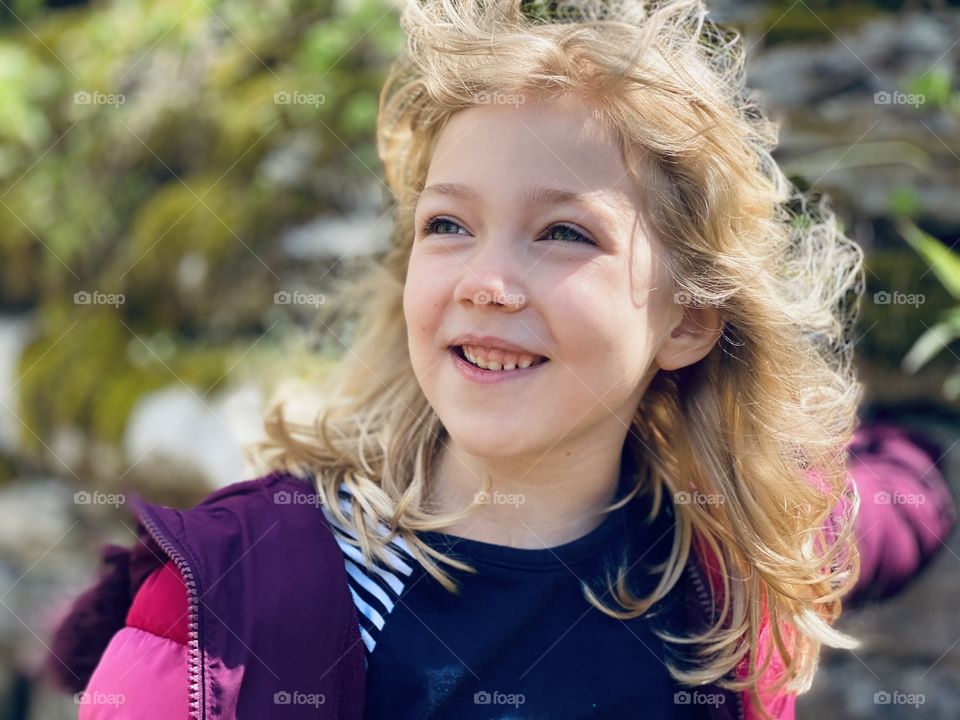 A little girl, happy that the weather is finally starting to warm up!