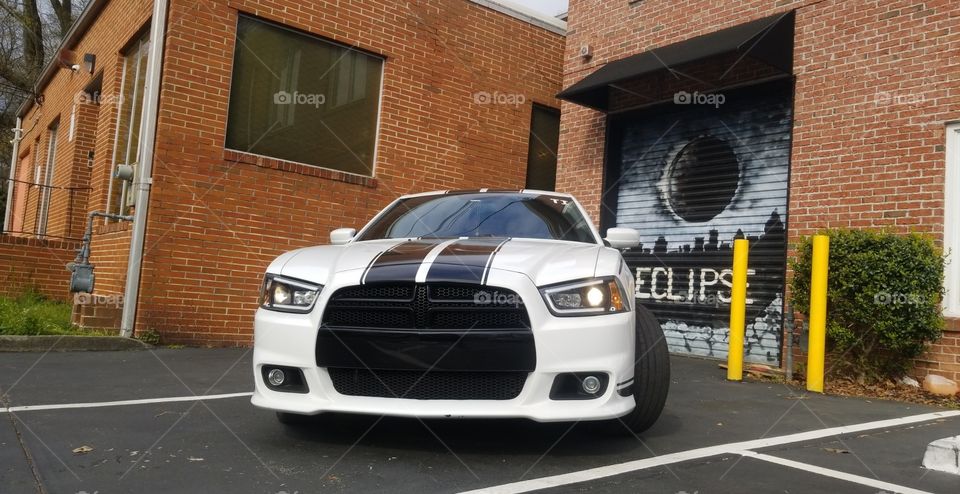 White Dodge Charger with urban eclipse graffiti