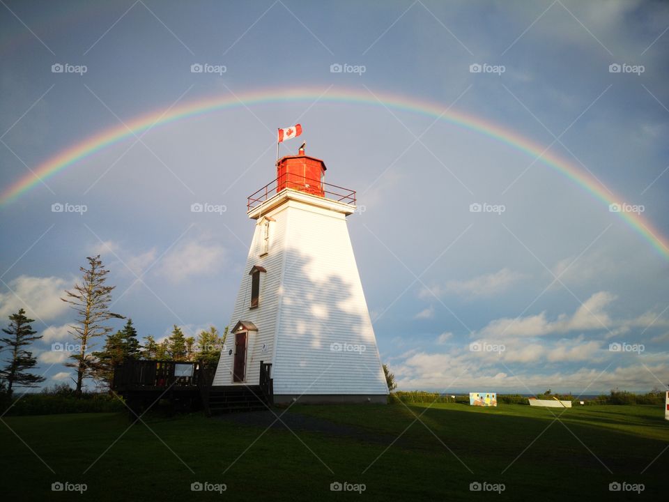 Canadian lighthouse with a rainbow. Cape Bear Lighthouse, P.e.i, Canada