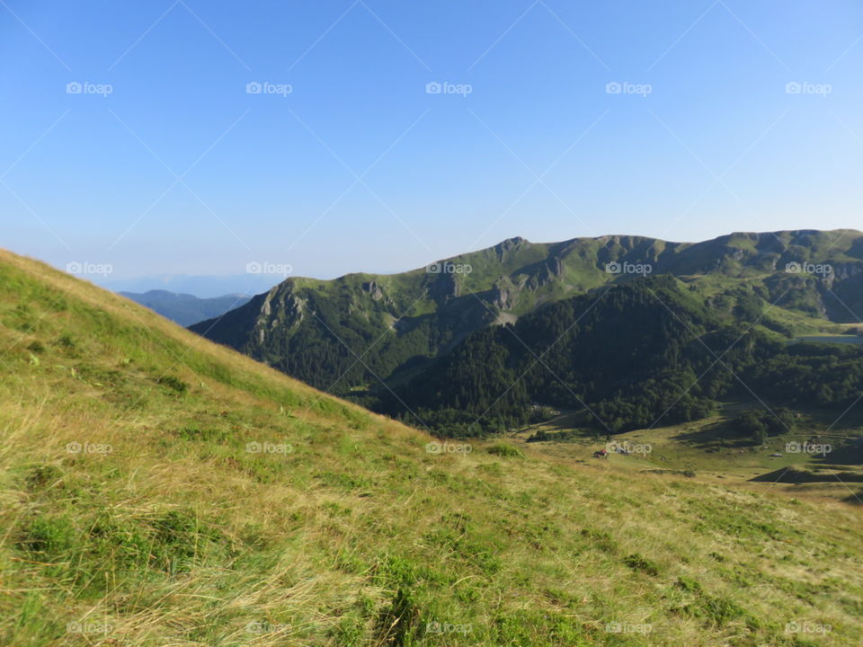 Mountain landscape valley and distant mauntain range
