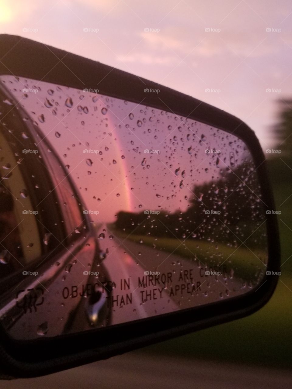 rainbow in rearview mirror