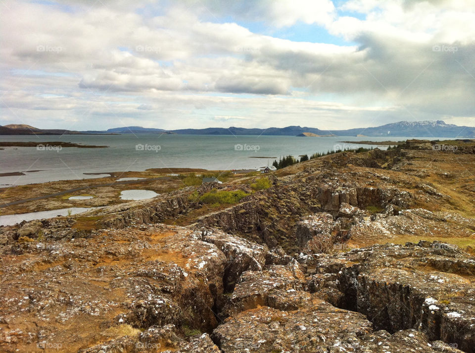 grey clouds water rocks by kristeressvik.com