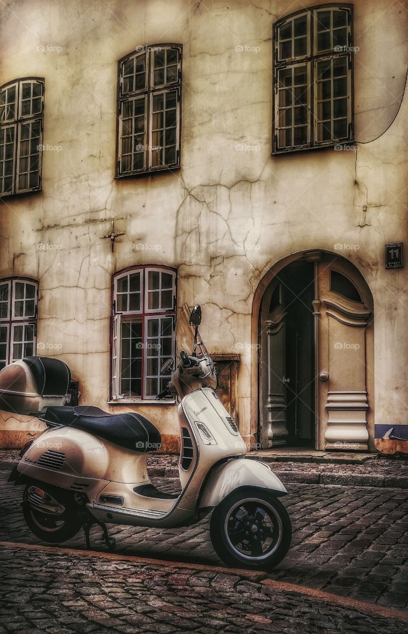 Vespa and old city