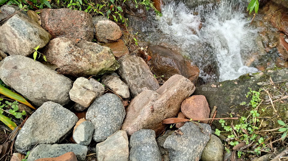 RIVER STONES WATER