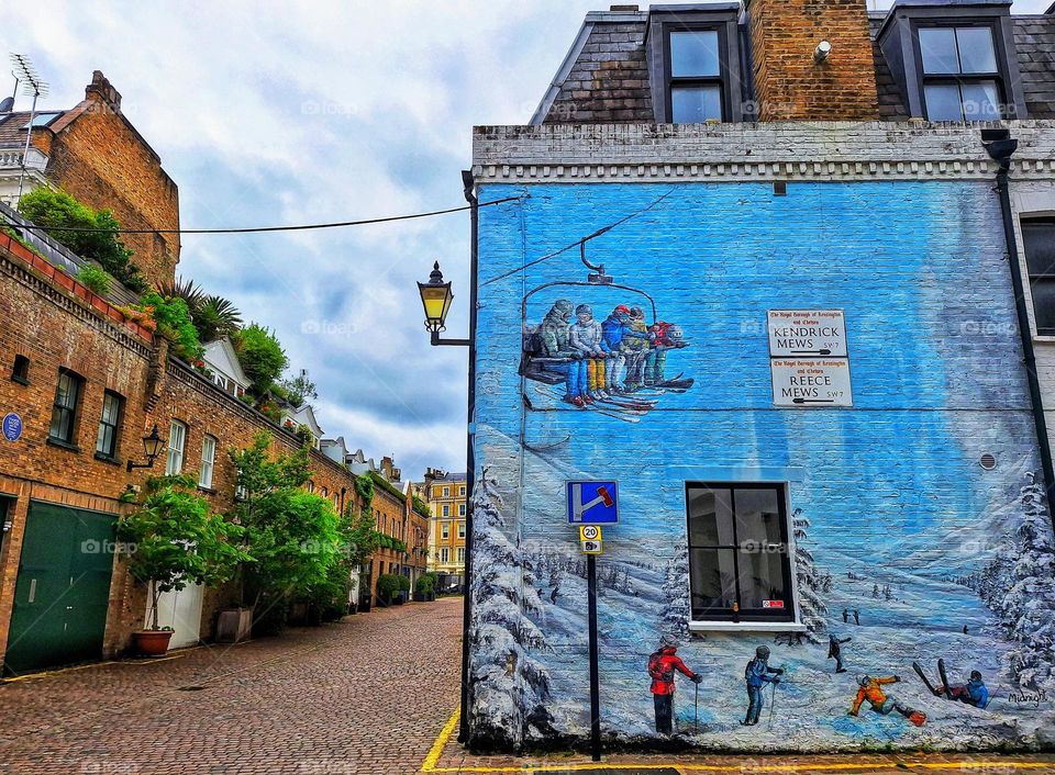 Unexpected mural of a winter ski scene on the wall of a South Kensington, London mews