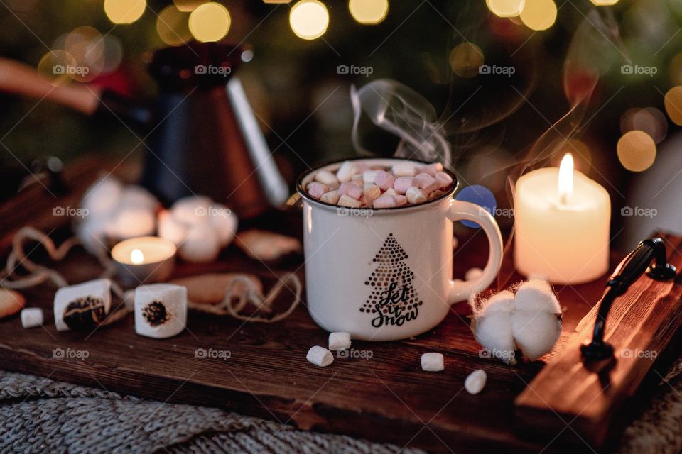 Freshly brewed coffee in white mug. Christmas mood. Hot beverages