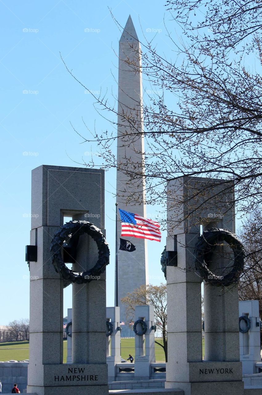 World War II Memorial and Washington Monument with American Flag in Washington DC