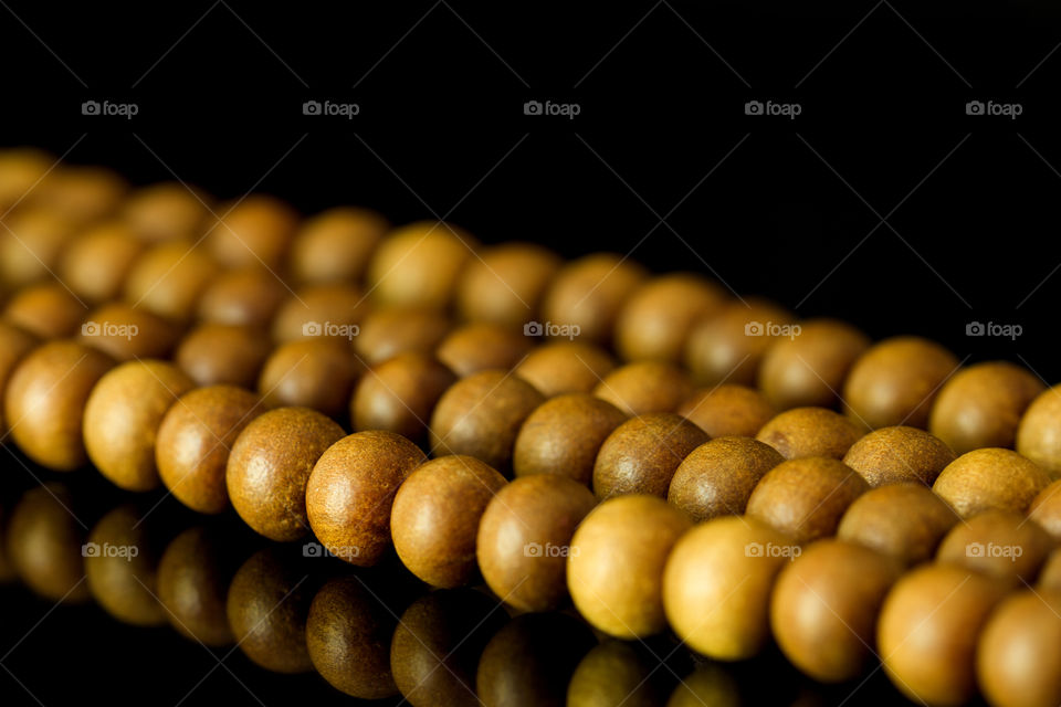 rosary on a black background . close up