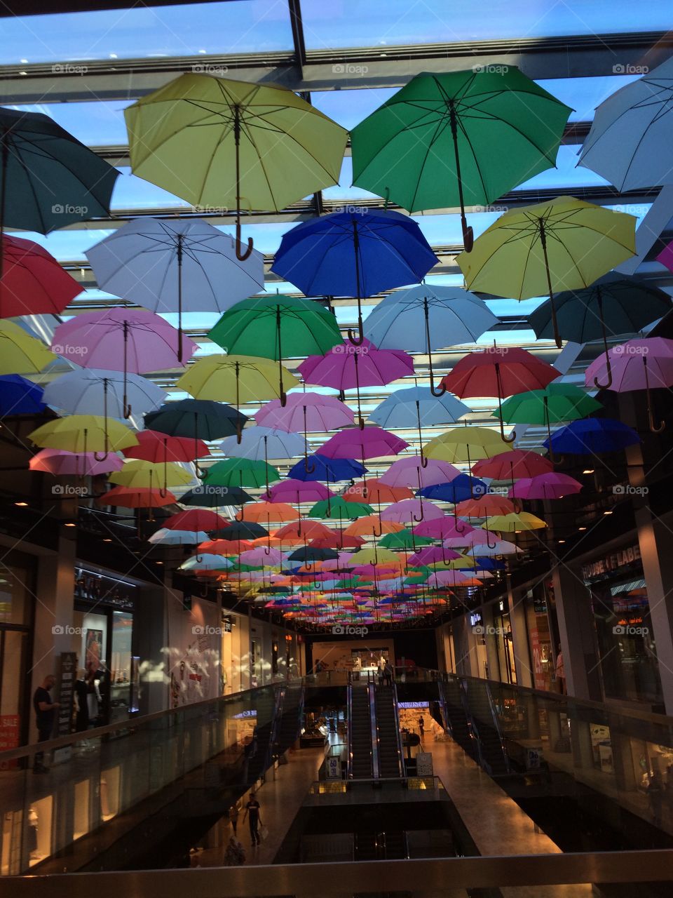 Colorful umbrellas hanging over roof