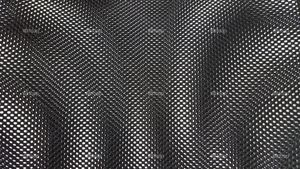 Creative texture - black and white holes,  abstract pattern 