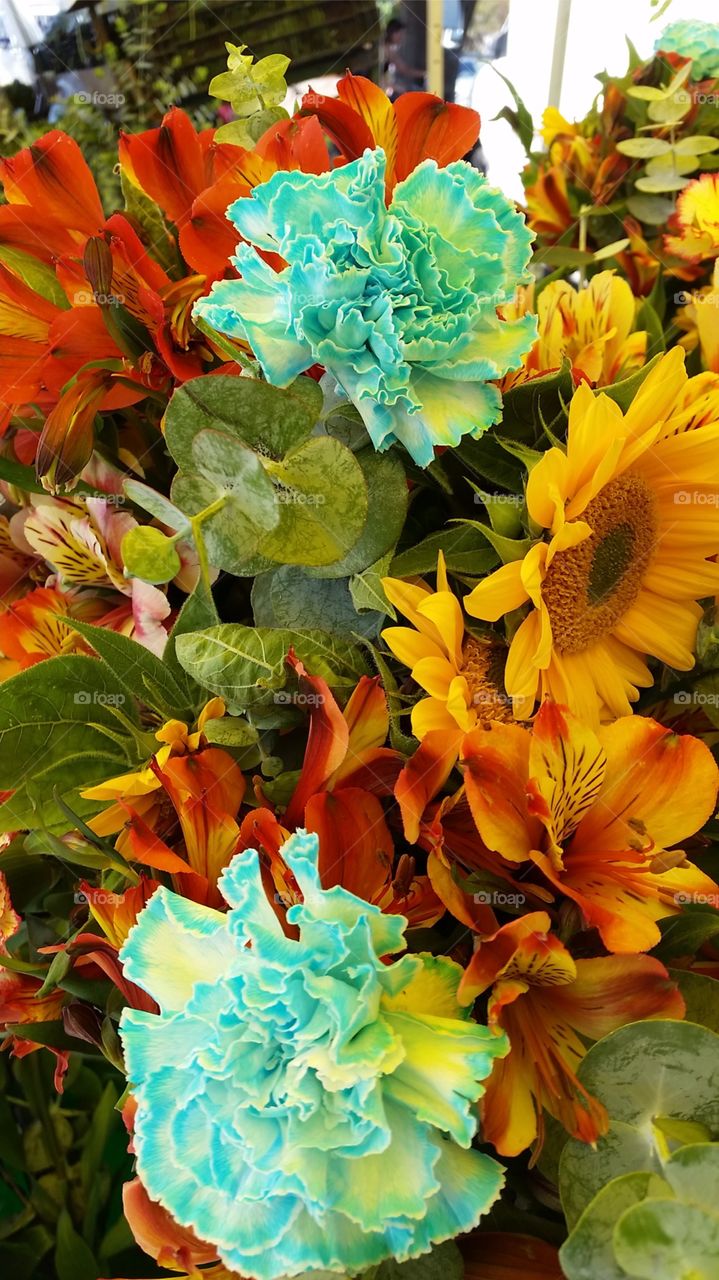 Hybrid flowers. Flower arrangement. Sunflower, carnations and Peruvian Lilly.