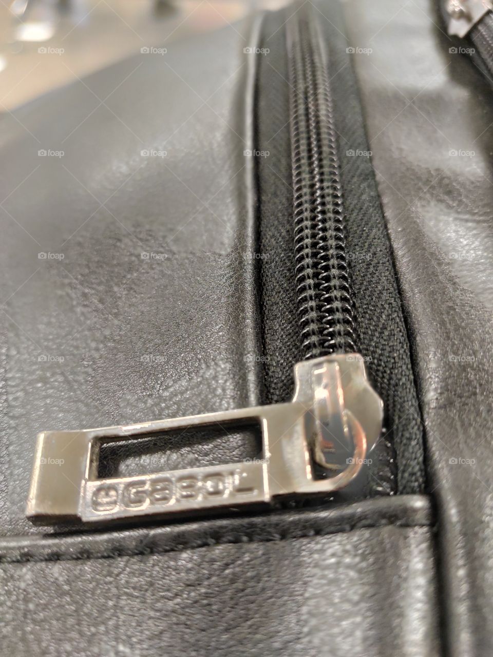 Macro image of a leather case with zipper