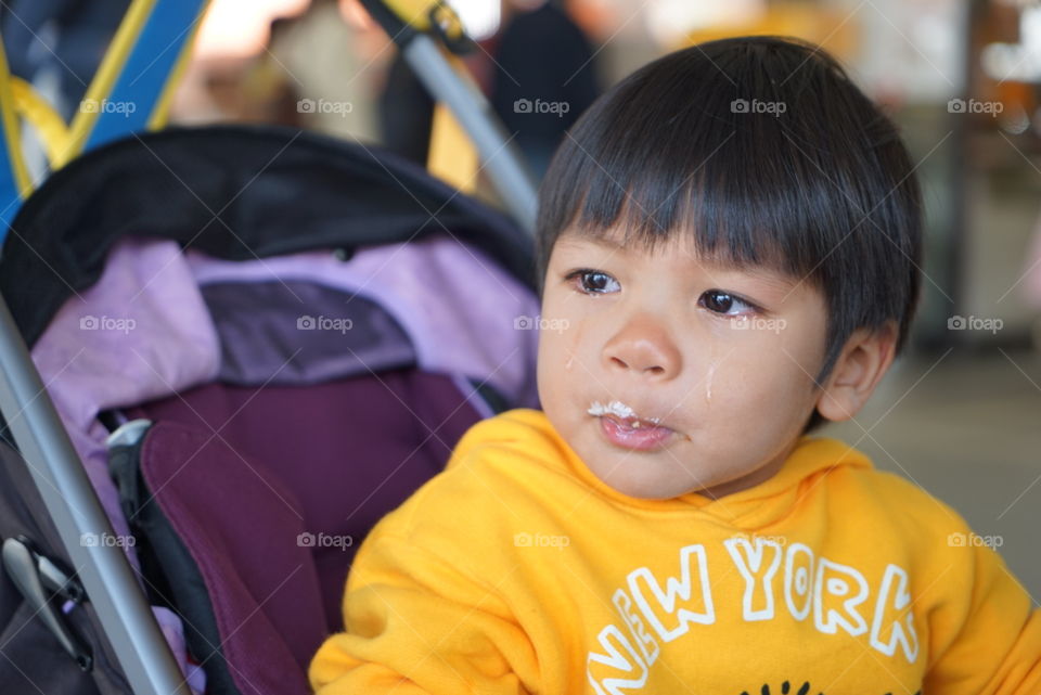 Crying hungry Asian boy