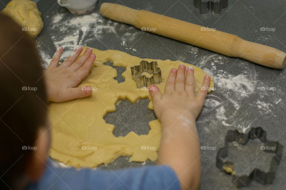 boy bakes cookies