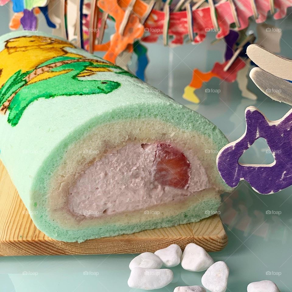 Stegosaurus and triceratops dino strawberry roll cake 