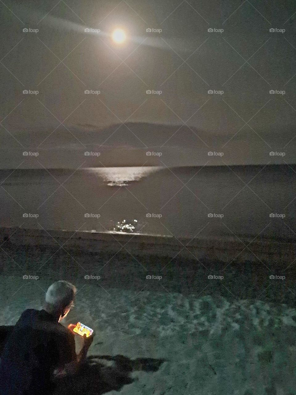 Man beneath the moon