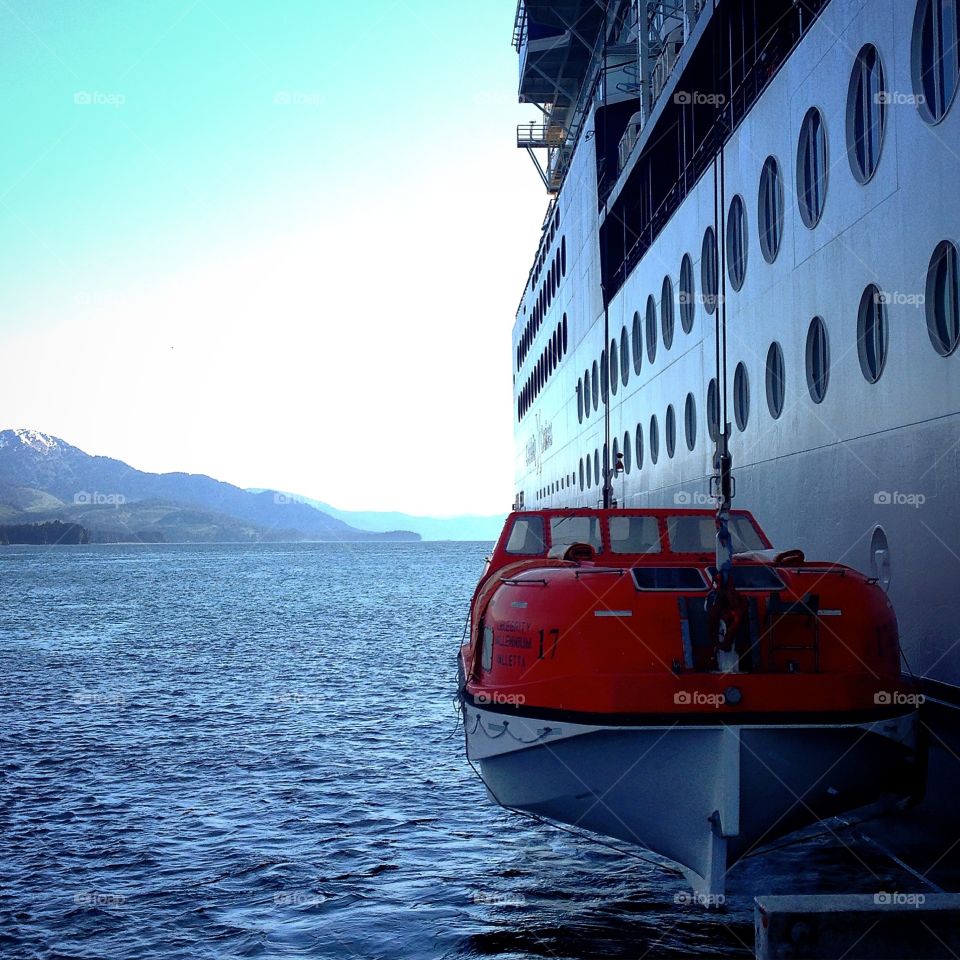 Honaah Alaska . Celebrity cruise's tender boat hovering above sea surface 