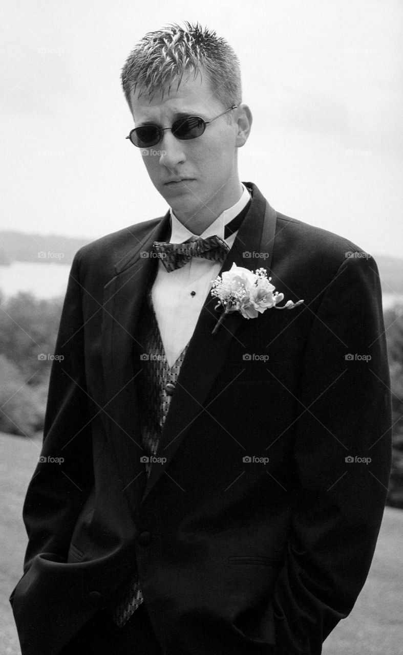 Young man in suit and bow tie black and white