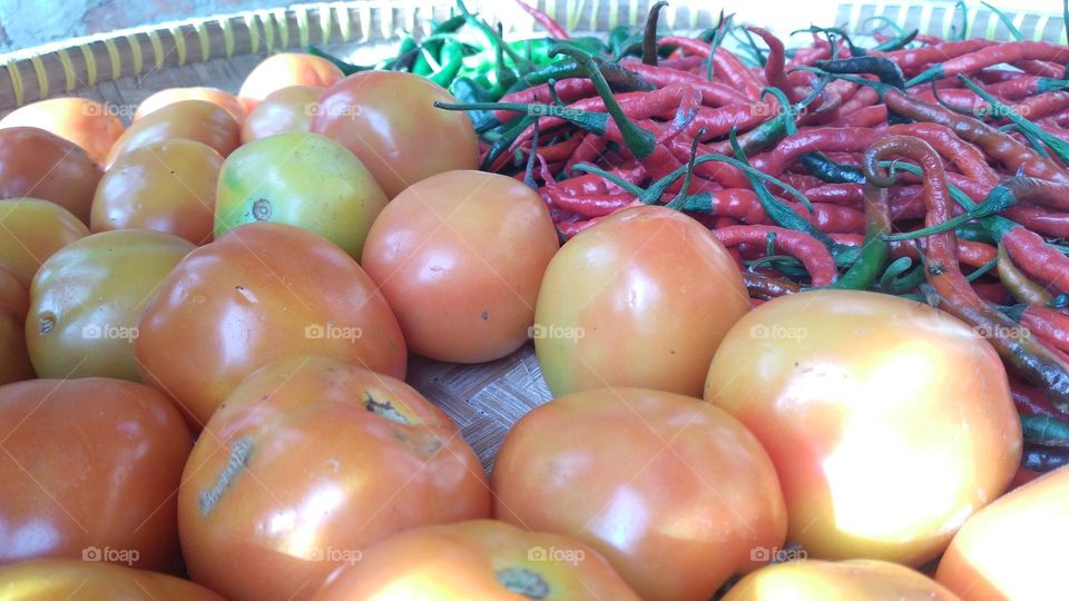 Tomato red chili and green chili in one container