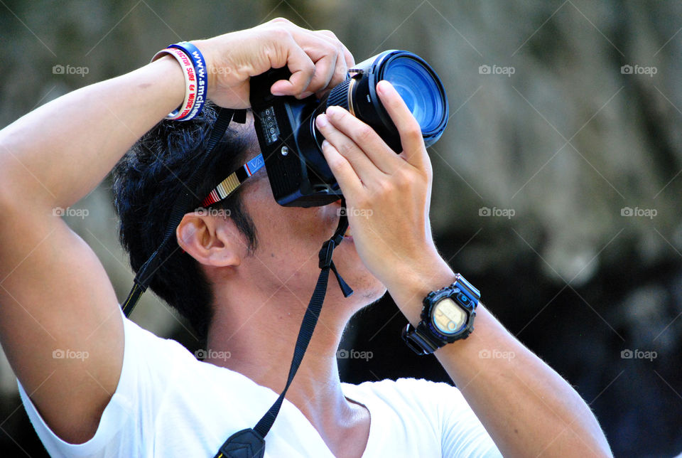 photographer using dslr to take a photo of the sky