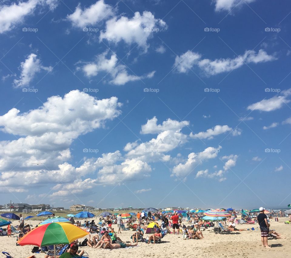 Clouds and umbrellas at the beach