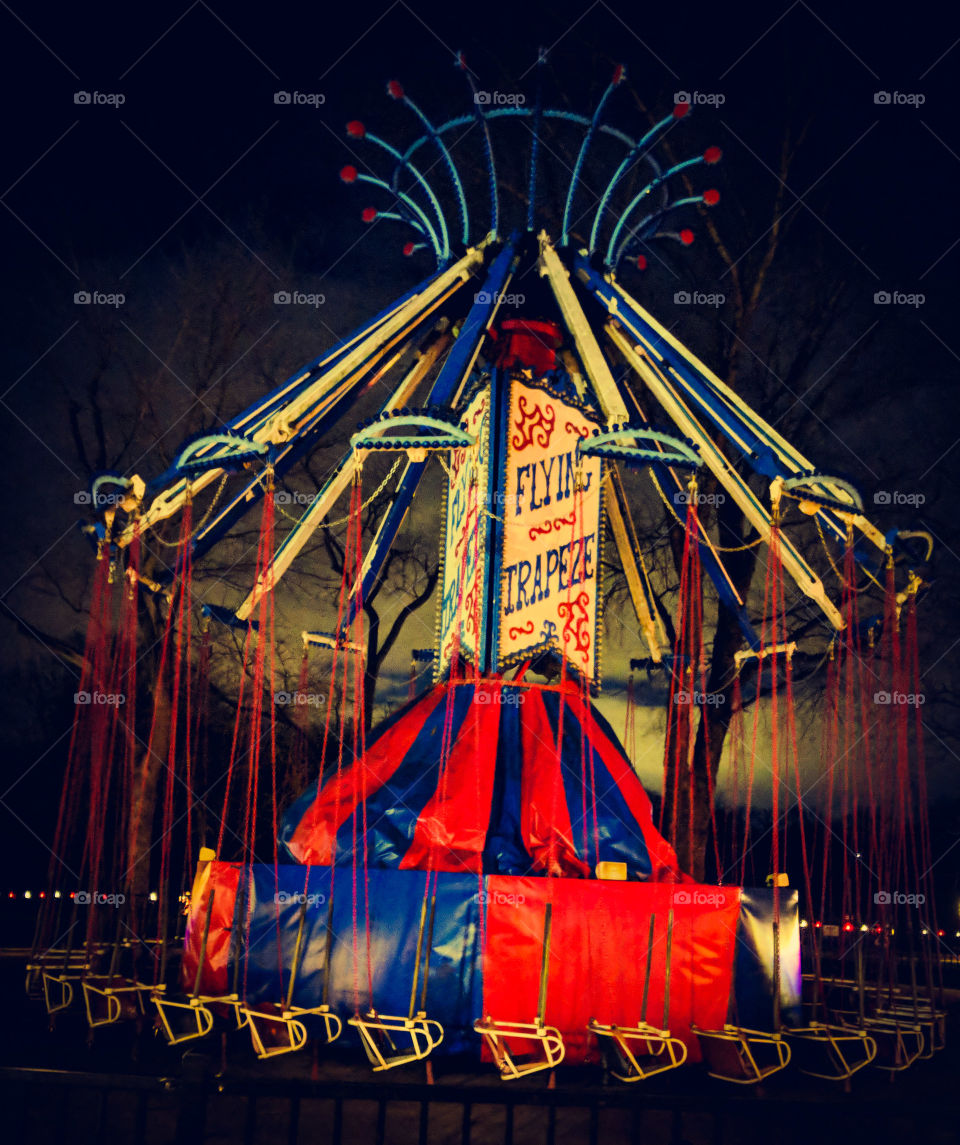 flying trapeze carnival ride in winter at night