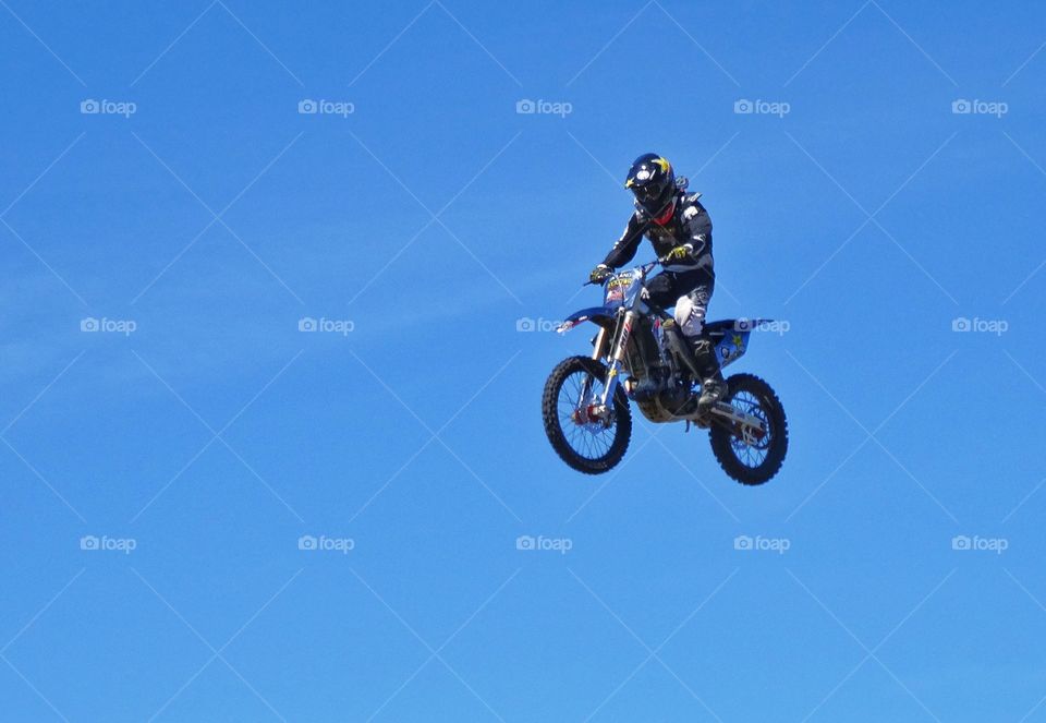 Motorcycle Jump. Jumping A Motorcycle High Into The Air
