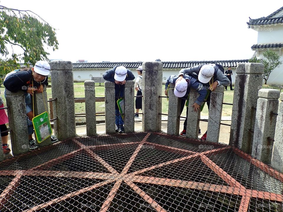 Curious Kids looking down the hole