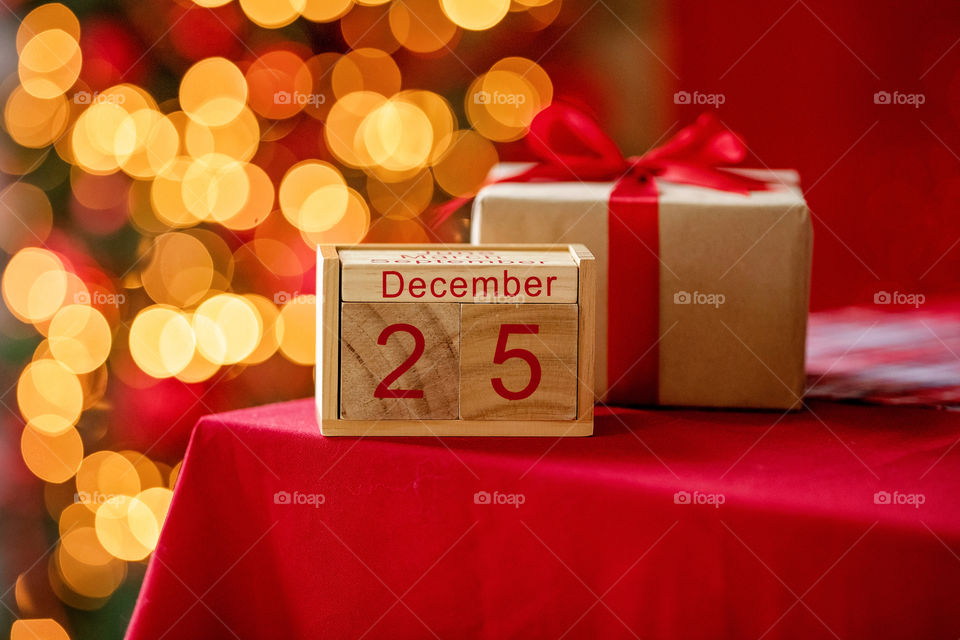 Christmas background with wooden block calendar with the date of December 25