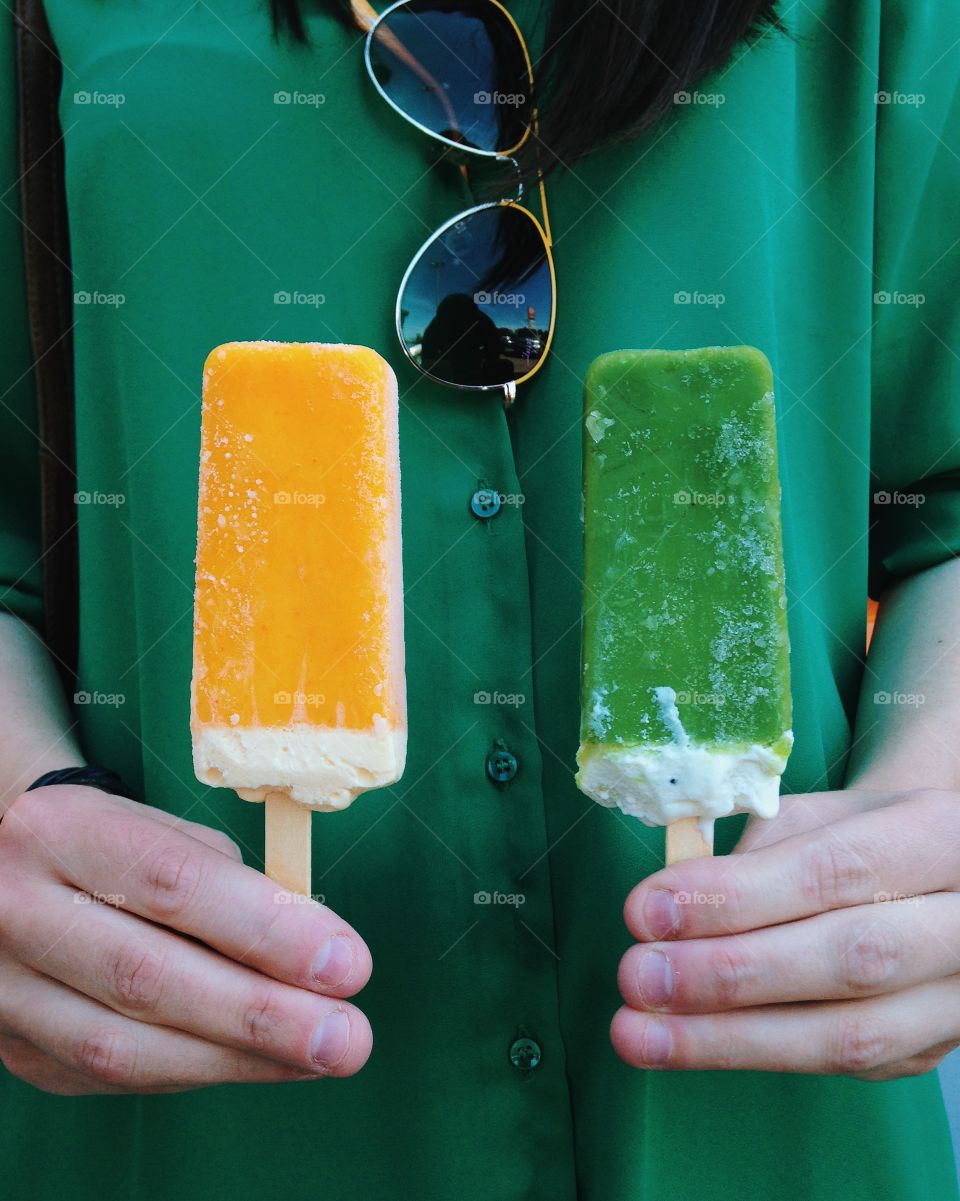 Person holding ice creams