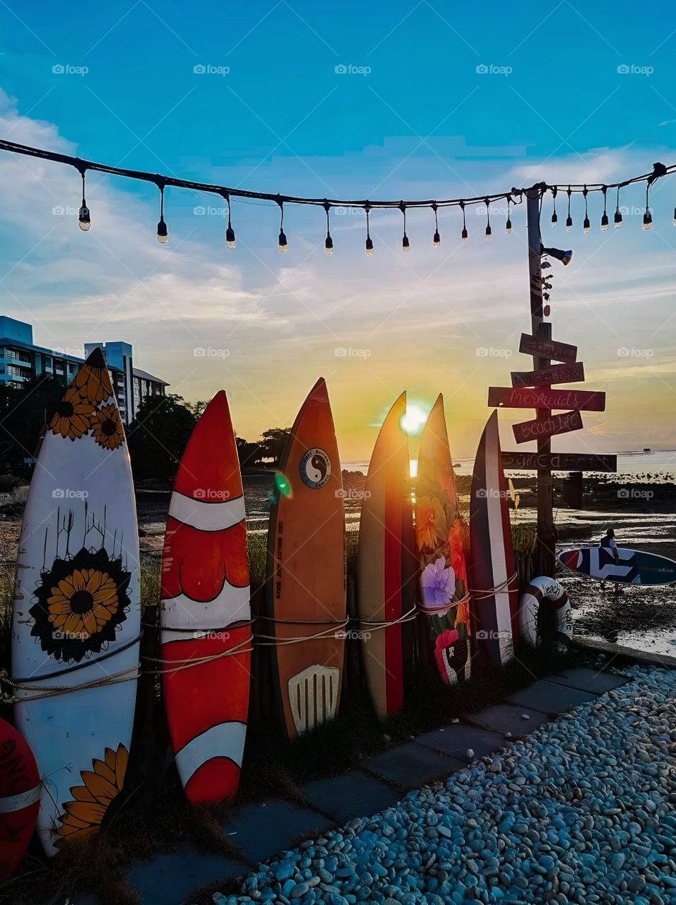 surf board stand at the beach sunset