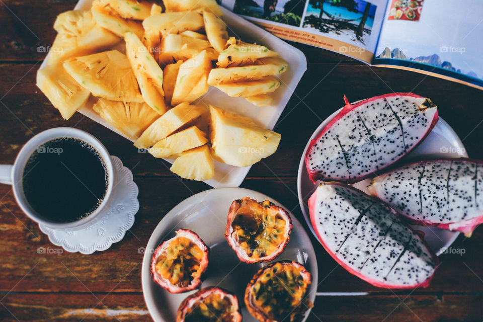 Exotic fruits and coffee for breakfast 