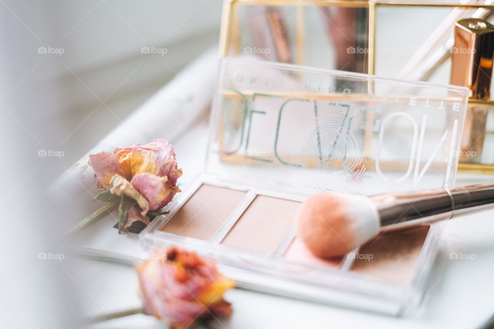 Makeup products on window sill