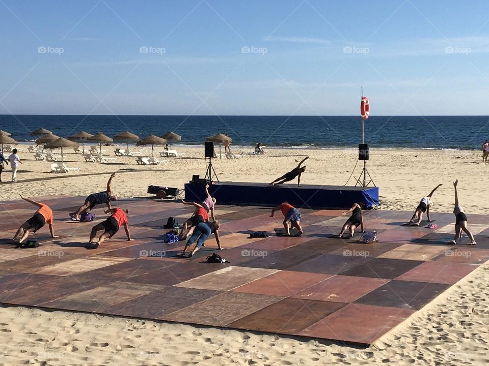 Yoga lesson on the beach