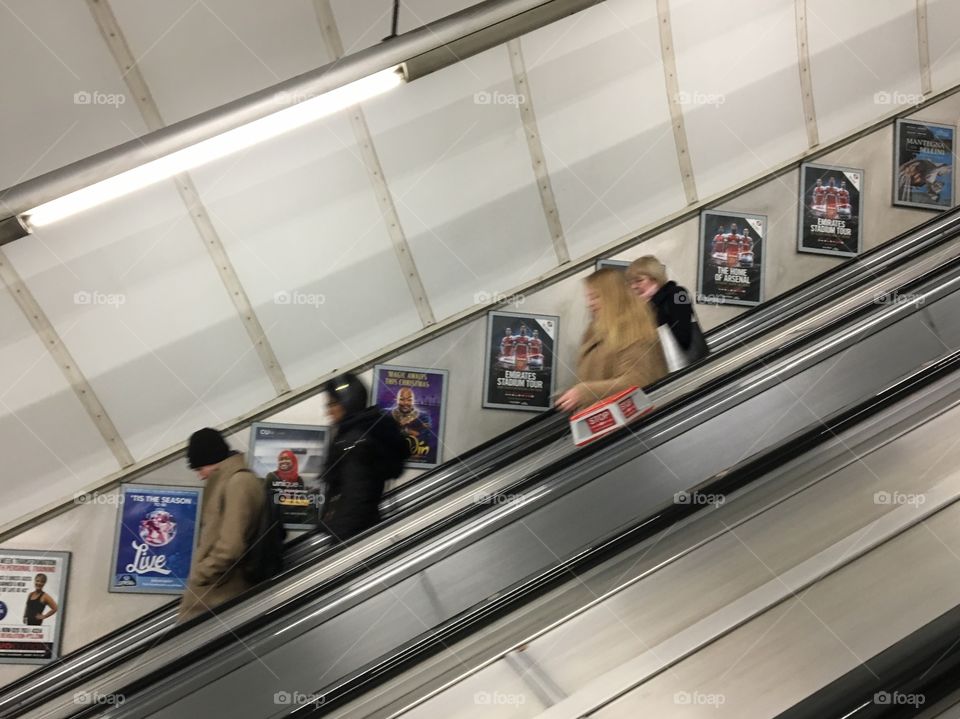 A to B with the help of an escalator 