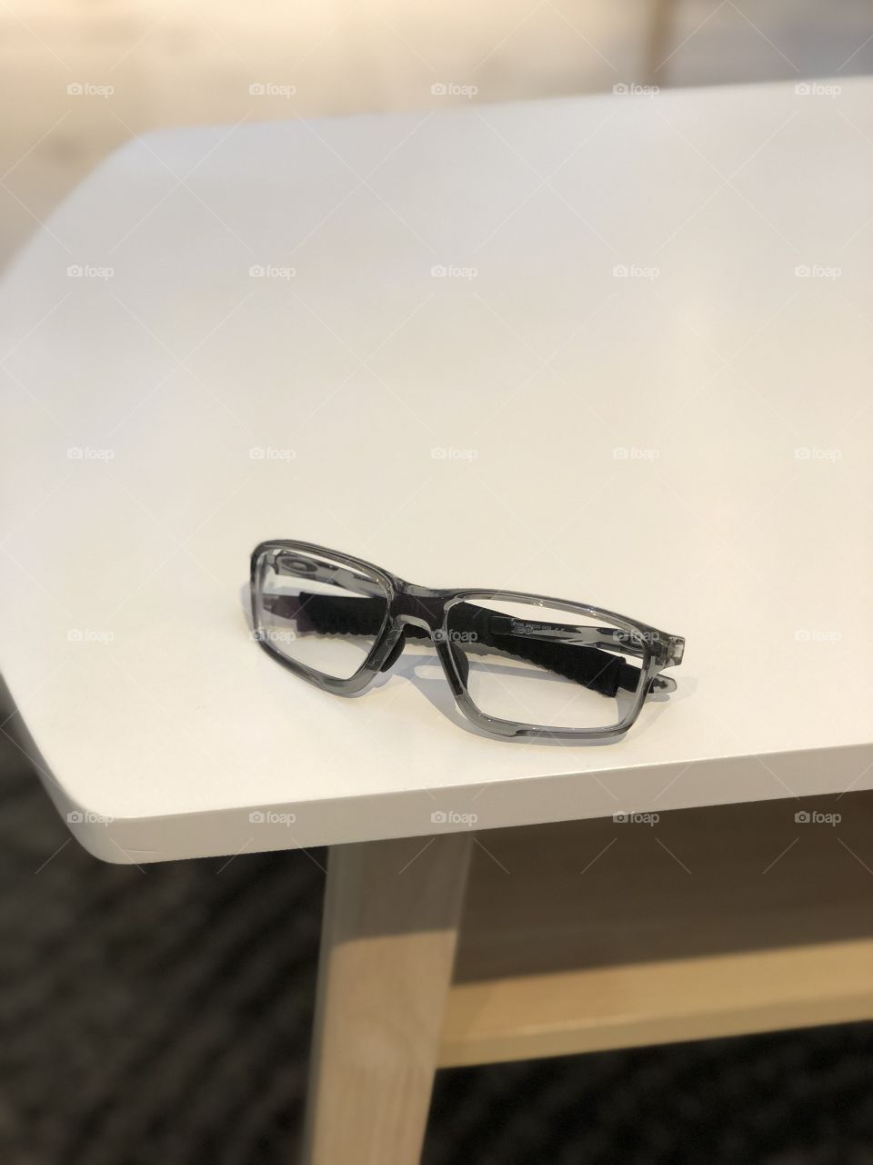Grey glasses on white table top