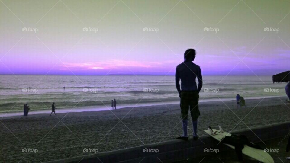 Purple Haze. Surfer at dusk