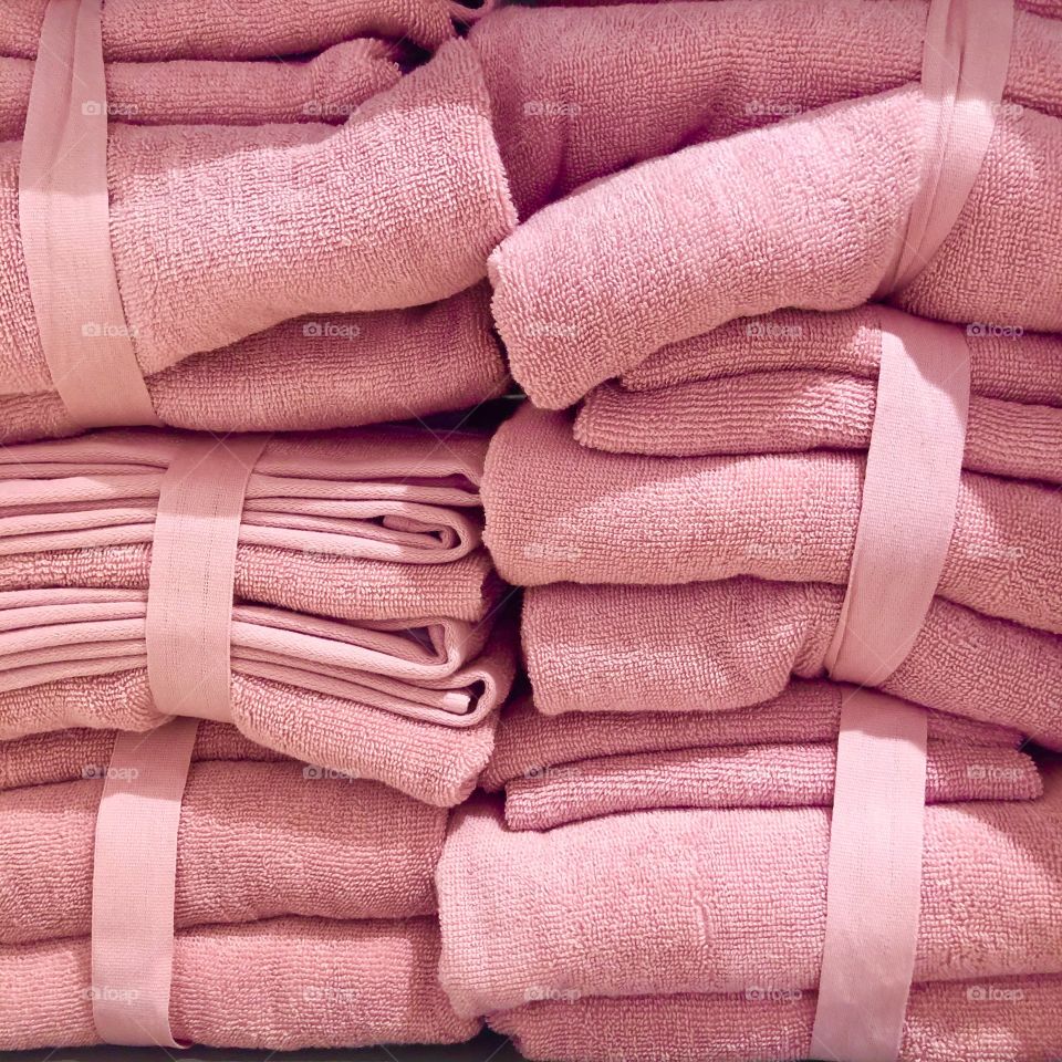 Bundles of pink bath towels