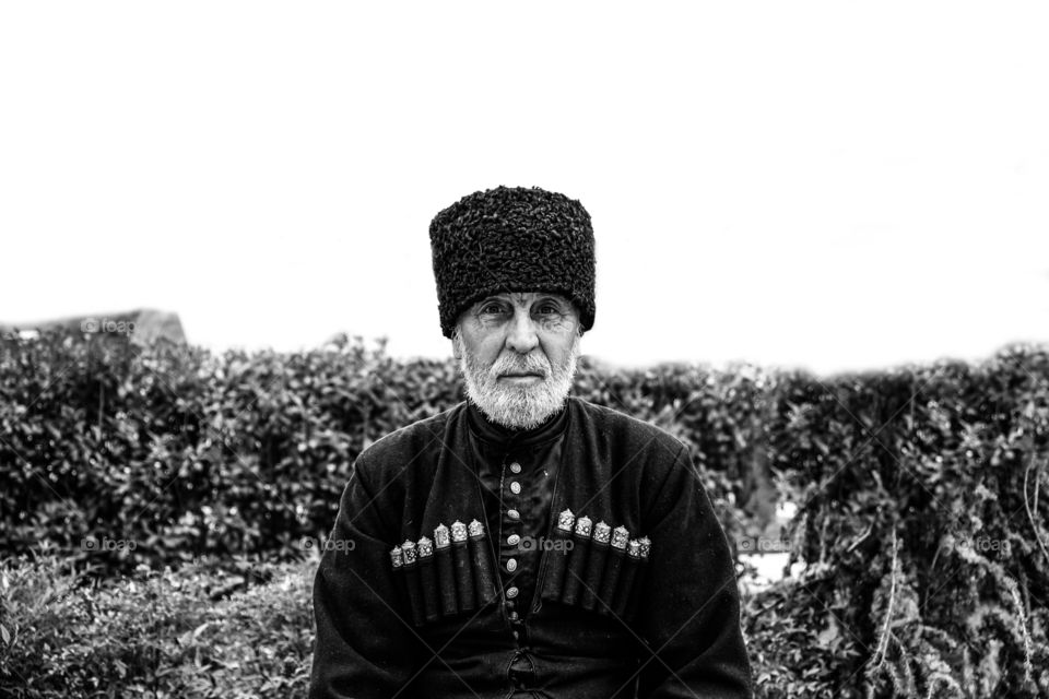 Portrait of senior man wearing hat