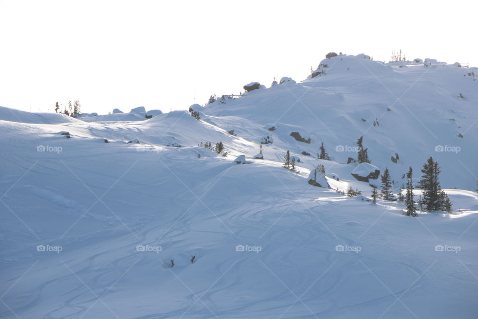 Enter wonderland on top of the mountain , tracks of skiing left on the snow